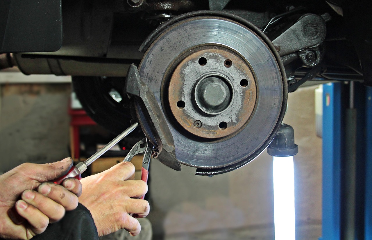 Professional car stereo team in workshop - automotive electronics installation experts